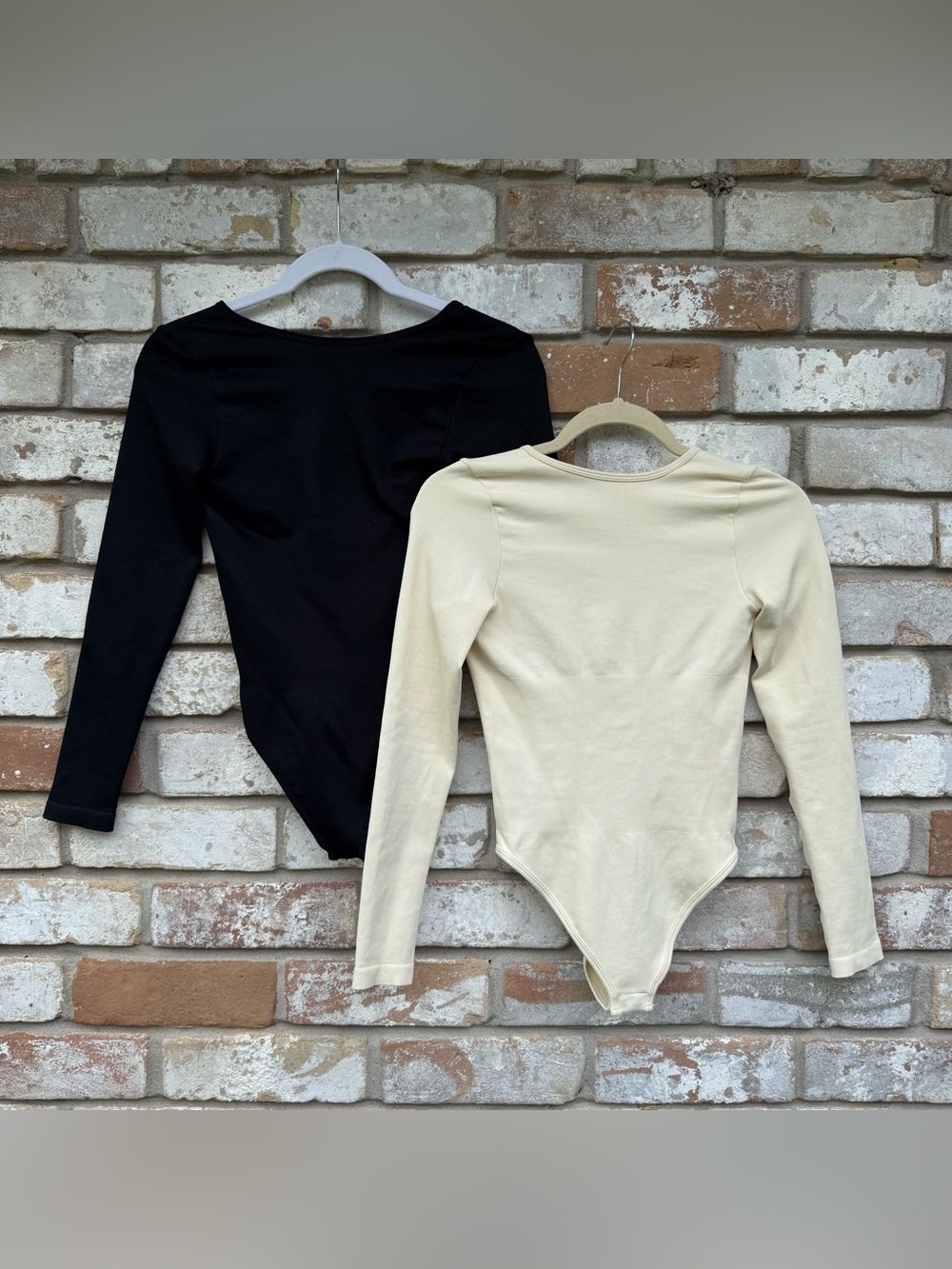 Two OQQ Ribbed Long Sleeved Bodysuits High Neck Low Cut Back
